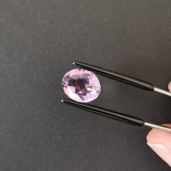 A photo of the crown area of the purple amethyst against a black background