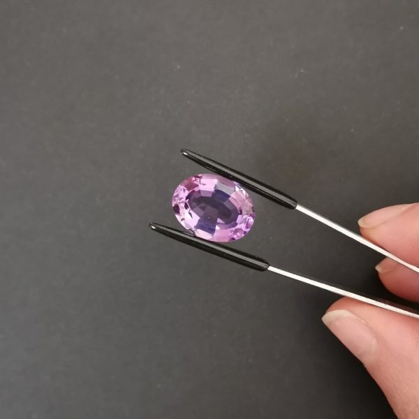 A photo of the crown area of the purple amethyst against a black background