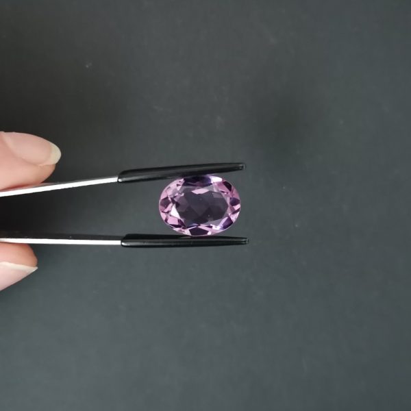 A photo of the crown area of the purple amethyst against a black background