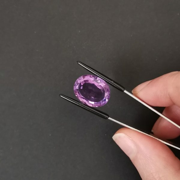 A photo of the crown area of the purple amethyst against a black background