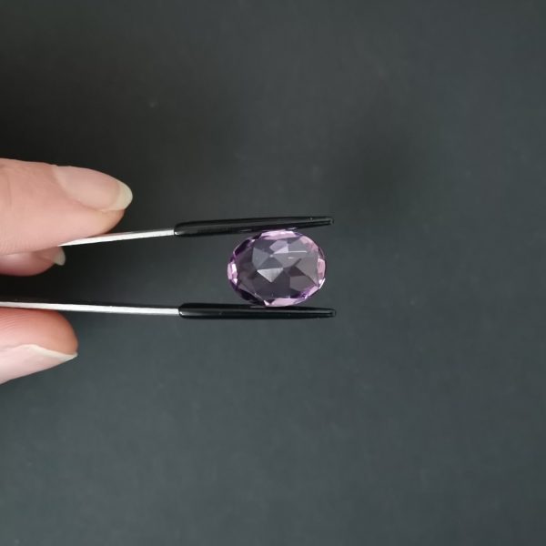 a photo of the pavilion of the purple amethyst oval against a black background