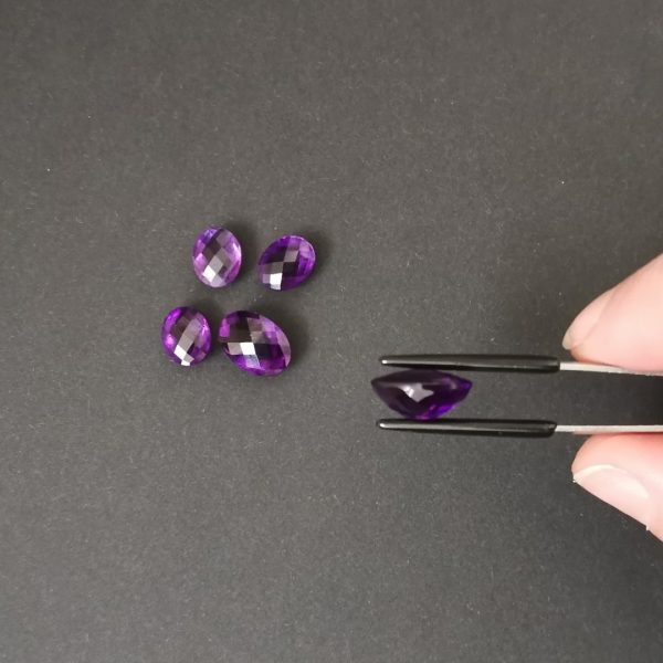 A side view of the purple amethysts showing the pavillion doesn't end in a point.