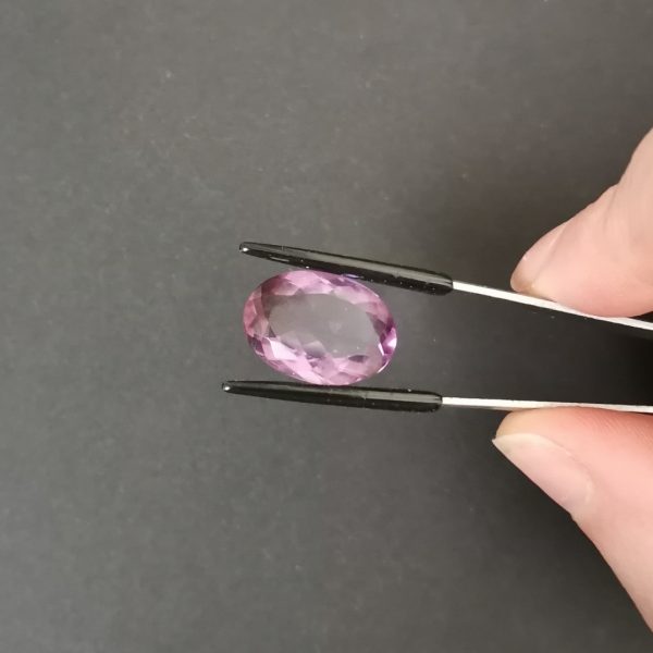 A photo of the crown area of the purple amethyst against a black background