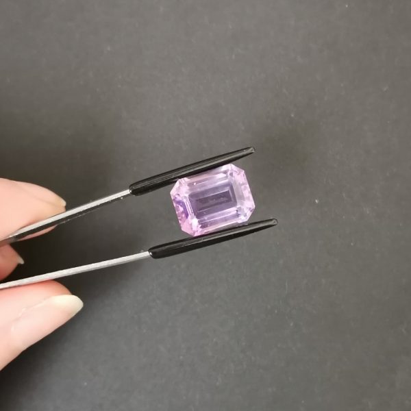 A photo of the crown area of the purple amethyst against a black background