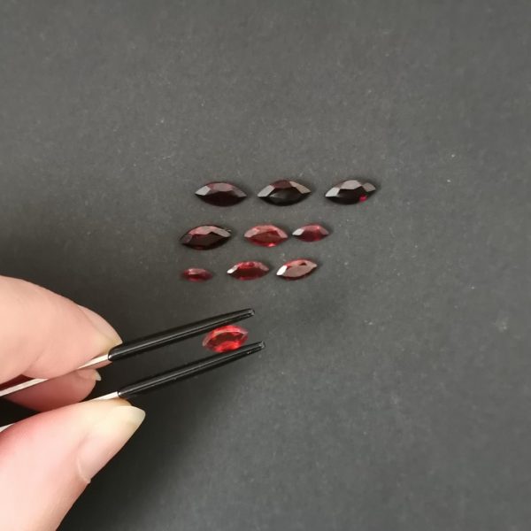A photo of the crown area of the red garnets against a black background