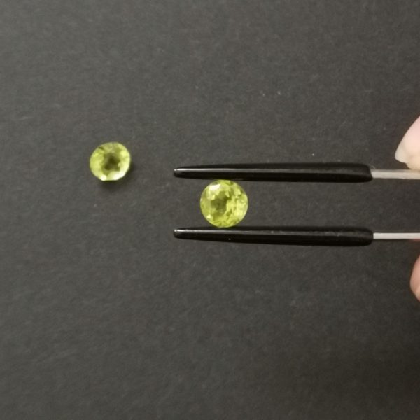 A photo of the crown area of the peridots against a black background