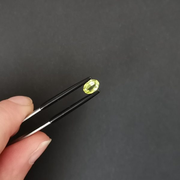 photo of the crown area of the peridot against a black background