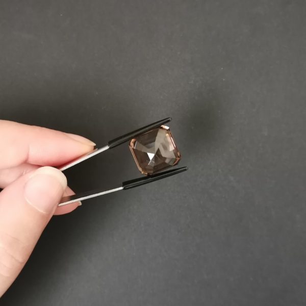 a photo of the pavilion of the brown smoky quartz against a black background