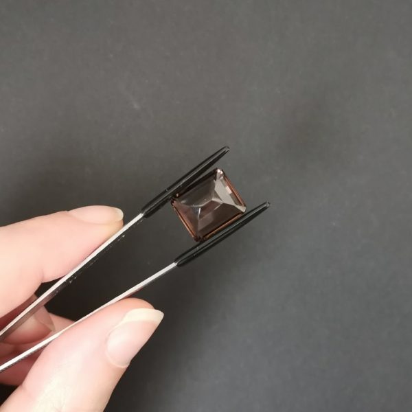 a photo of the pavilion of the brown smoky quartz against a black background