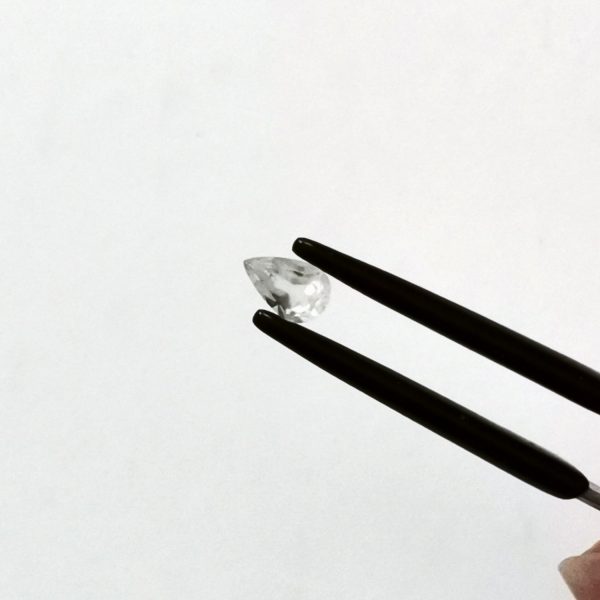 A photo of the crown area of the white moonstone against a white background