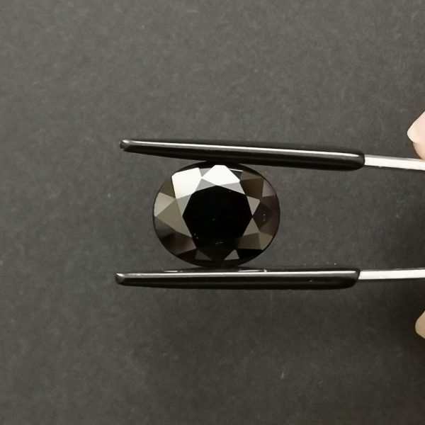 A photo of the crown area of the black sapphire against a black background
