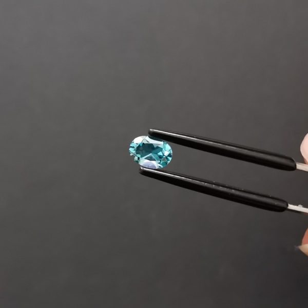 A photo of the crown area of the london blue topaz against a black background