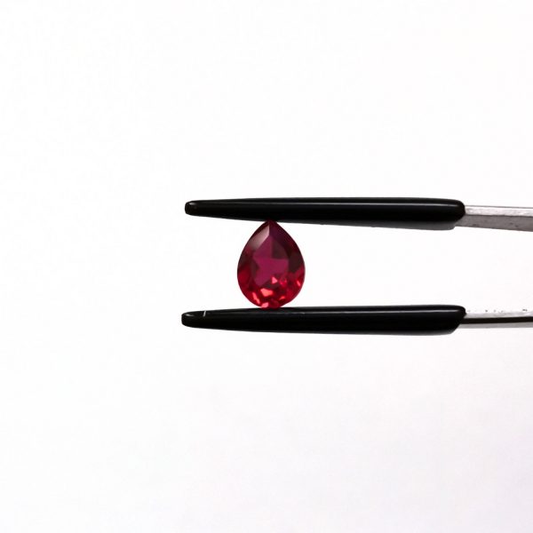 A photo of the crown area of the lab grown ruby against a white background