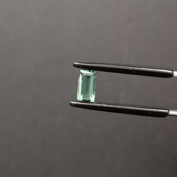 A photo of the crown area of the two tone tourmaline against a black background