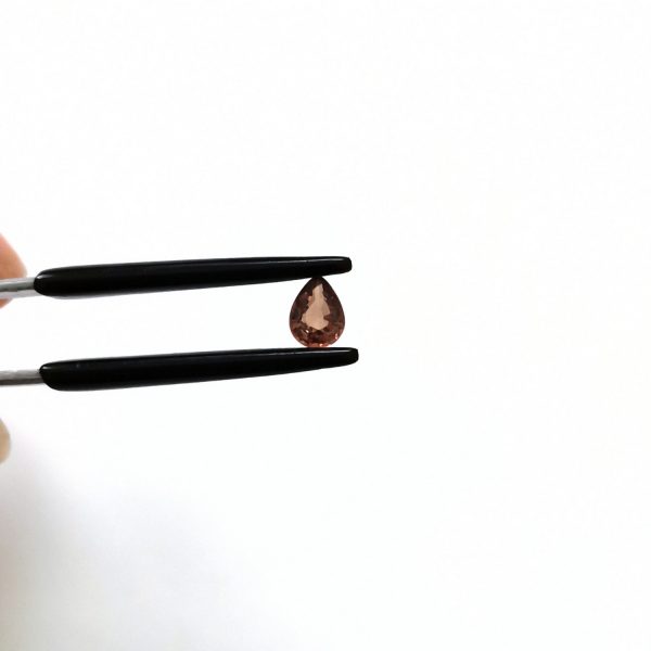 A photo of the crown area of the brown sapphire against a white background