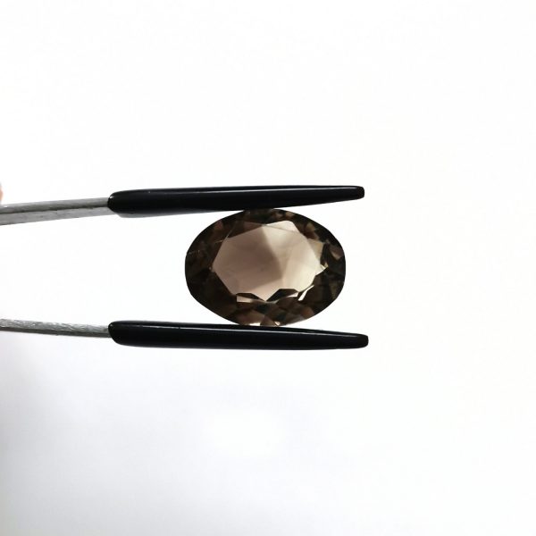 A photo of the crown area of the brown smoky quartz against a white background