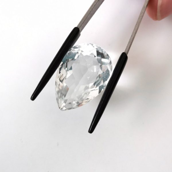 A photo of the crown area of the clear quartz against a white background