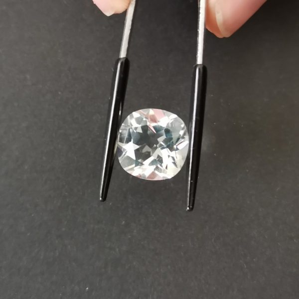 A photo of the crown area of the clear quartz against a black background