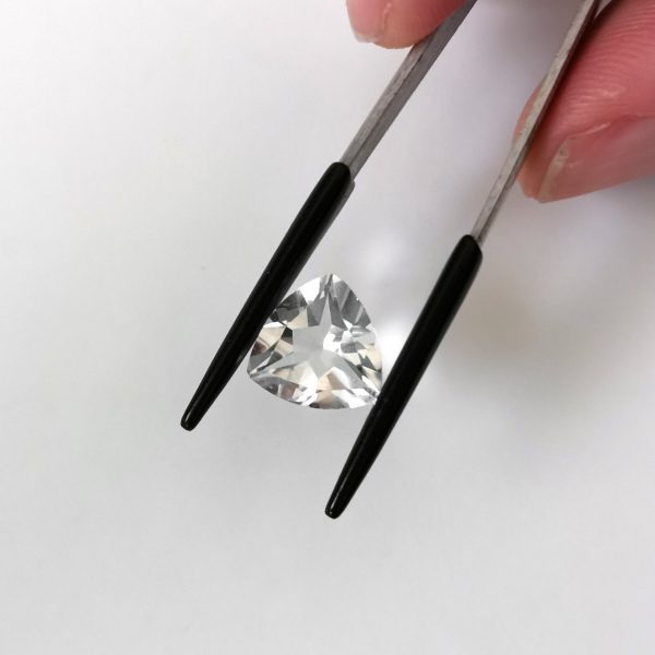 A photo of the crown area of the clear quartz against a white background