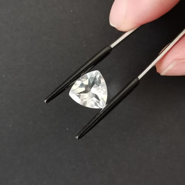 A photo of the crown area of the clear quartz against a black background