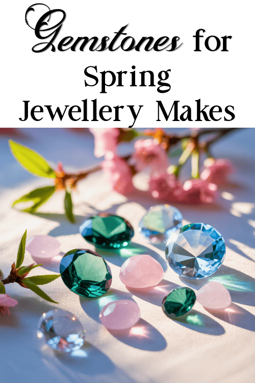 Assorted gemstones in pink, green, and blue hues are scattered on a white surface, accented by pink cherry blossoms. The text reads "Gemstones for Spring Jewellery Makes."
