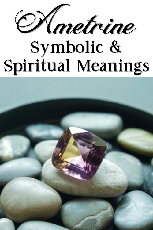 A radiant ametrine gemstone placed on smooth pebbles in a dish. Text above reads "Ametrine Symbolic & Spiritual Meanings" in elegant font. Calm and mystical tone.