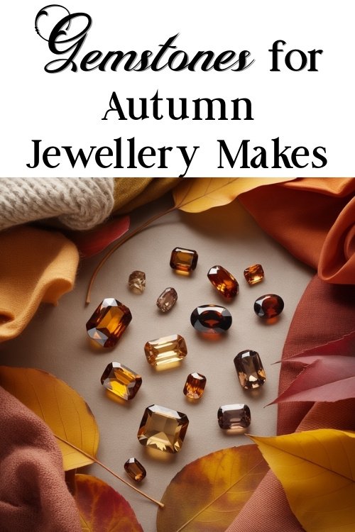 Assorted amber and brown gemstones surrounded by autumn leaves and warm fabrics, suggesting cozy and elegant fall jewelry creations. Text reads "Gemstones for Autumn Jewellery Makes."
