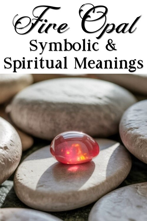 A vibrant fire opal sits on smooth gray stones, glowing with orange hues under sunlight. The text above reads "Fire Opal Symbolic & Spiritual Meanings."