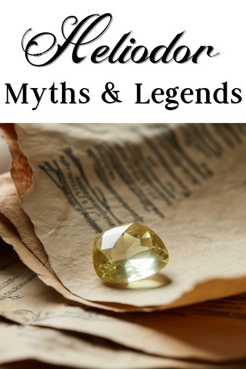 A faceted yellow Heliodor gemstone rests on aged, textured papers with cursive writing. The text above reads, "Heliodor Myths & Legends."