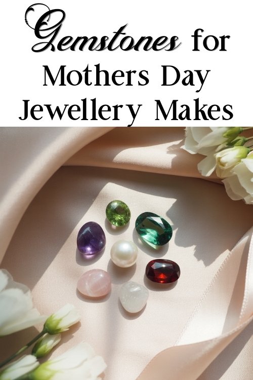 A variety of gemstones, including green, purple, red, pearl, pink, and white, are displayed on peach fabric with white flowers. Text: "Gemstones for Mothers Day Jewellery Makes."
