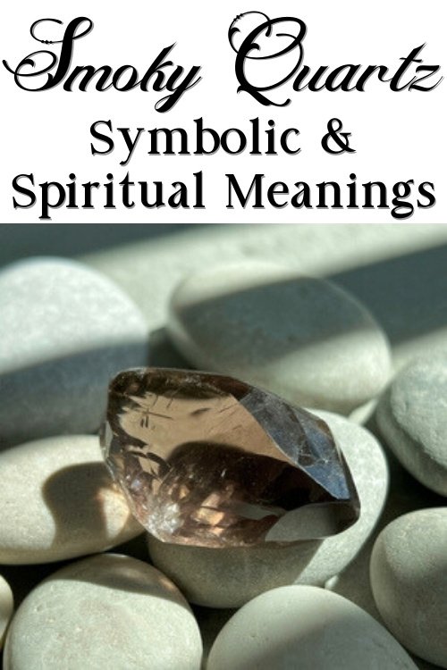 A smoky quartz crystal rests on smooth white stones, highlighted by soft sunlight. Text above reads "Smoky Quartz: Symbolic & Spiritual Meanings."