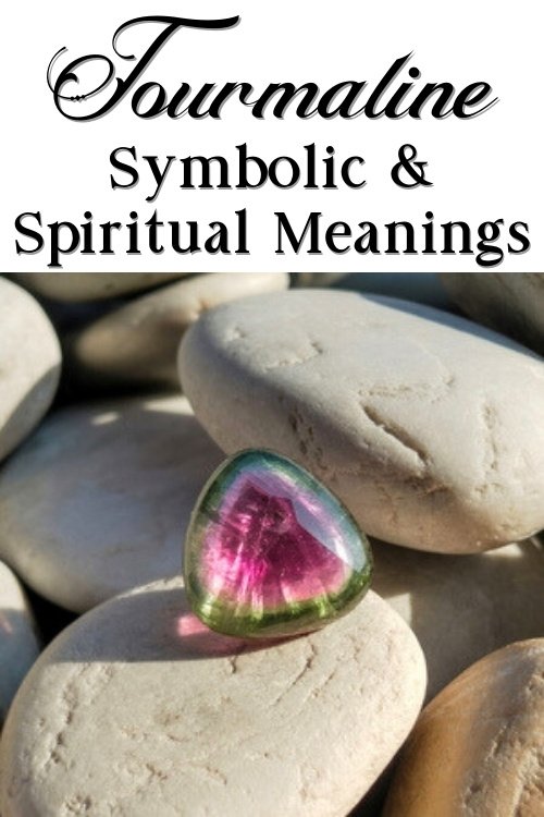A vibrant watermelon tourmaline gemstone sits atop smooth gray stones, sunlit and highlighting its pink and green hues. Text reads "Tourmaline Symbolic & Spiritual Meanings."