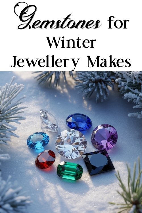 Assortment of colorful gemstones on snow, surrounded by frosty pine branches. Text reads "Gemstones for Winter Jewellery Makes."
